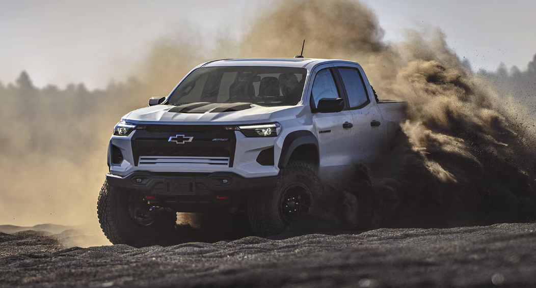 A Silverado ZR2 Bison off roading in jungle front chase view